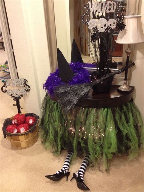 Turning your home into a haunted manor with a sitting witch for Halloween